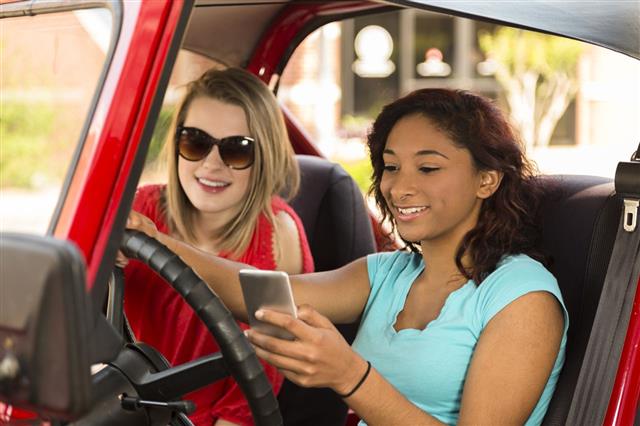 Teenage Girl Texting While Driving Car