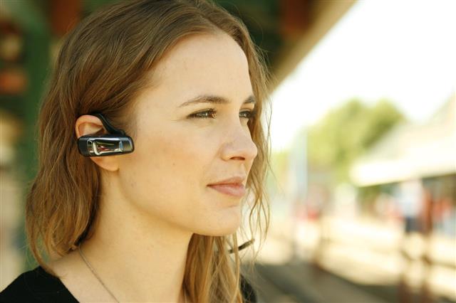 Woman Using Bluetooth Headset