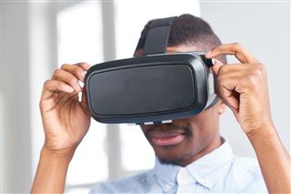 African Guy Adjusting Virtual Reality