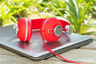 Vivid Red Headphones And Laptop