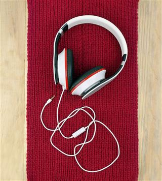 Headphones On Red Knitted Scarf