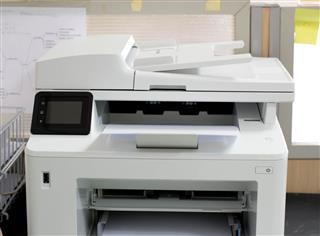 White Printer And Paper Laser Printer