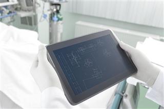 Doctor Holding A Tablet