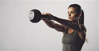 Woman exercise with kettle bell