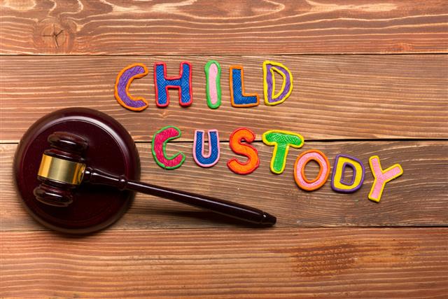 Judge gavel and colourful letters regarding child custody