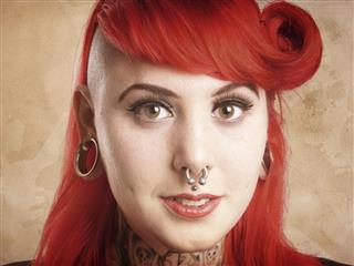 Girl with piercings and tattoos
