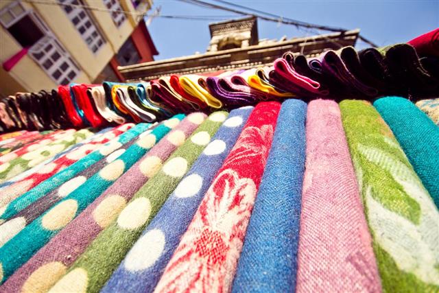 Pile of gentle folded shawls (scarfs)