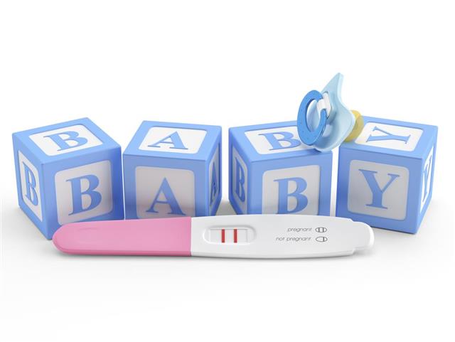 Pregnancy Test  Baby pacifier and with blocks word baby