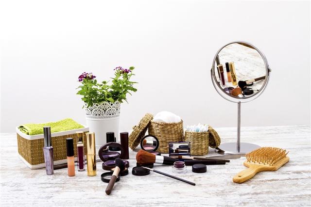 Make-up spread over a vanity with a mirror