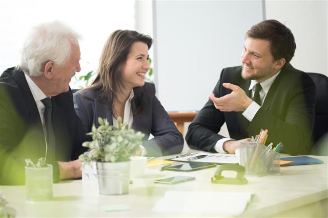 People laughing during business appointment