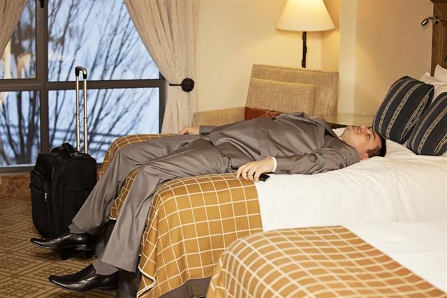 In bed at last tired businessman