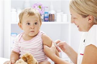 Crying Baby Girl Patient Receiving Vaccine
