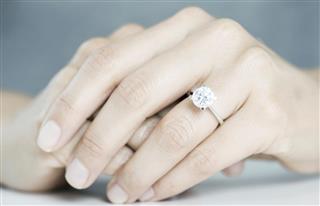 Woman Hands With Engagement Ring