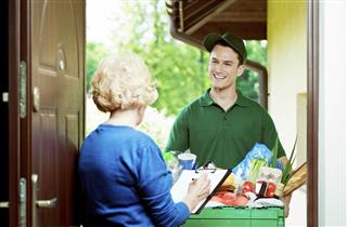 Delivery man with groceries