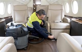 Man cleaning a private airplane