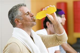 Drinking energy drink at gym