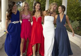 Teenage Girls Dressed for the Prom Walking and Having Fun