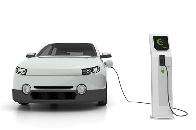 Electric car plugged into the charging station