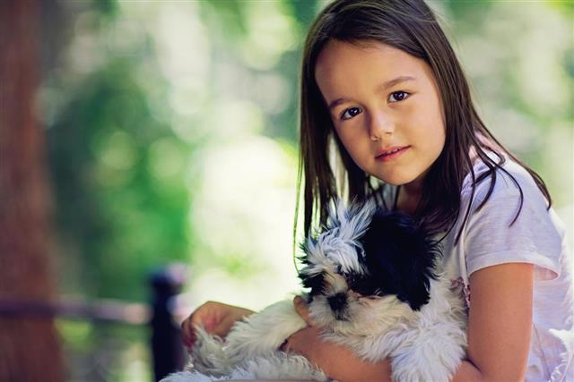 Portrait of the little girl with her dog