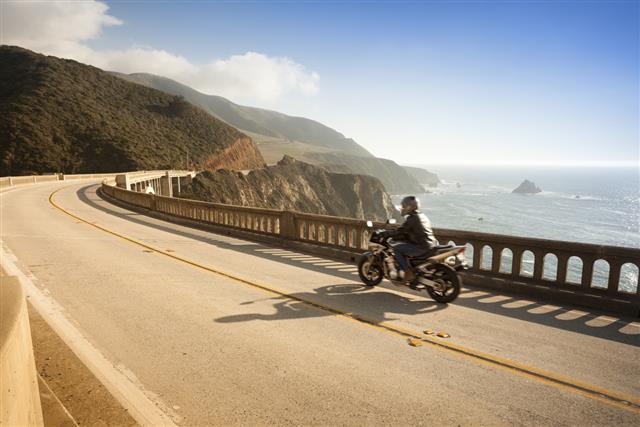 Motorcycle crossing the Bixby Bridge Big Sur California USA