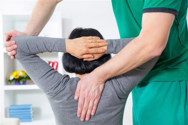 Chiropractor massage patient spine and back