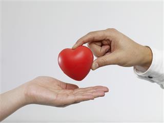 Man giving heart-shaped object
