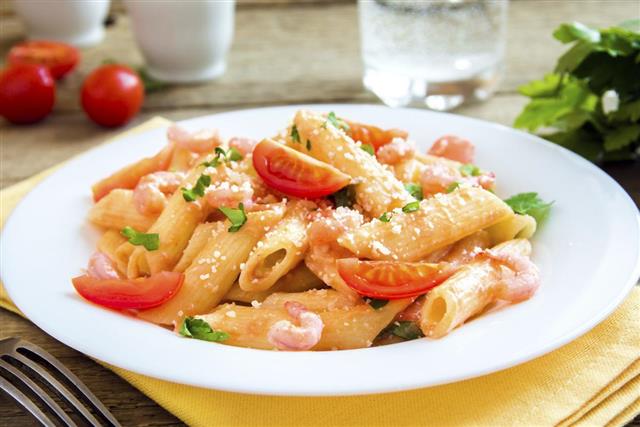 Shrimp pasta with tomato sauce and parmesan
