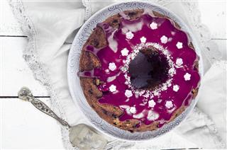 Cake with blueberries and blueberry glaze