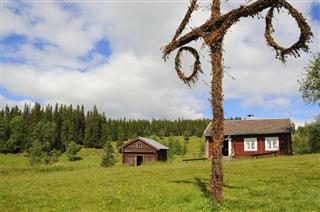 Beautiful cottage and barn with maypole in northern Sweden