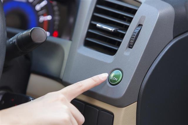 Hand finger press button eco mode inside car