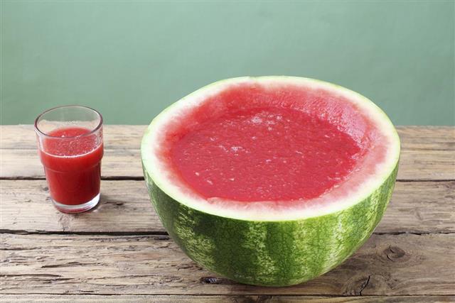 Watermelon smoothie on rustic table