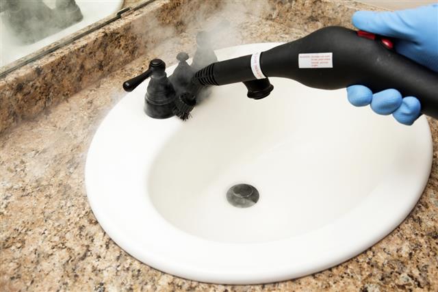 Steam Cleaning Bathroom Sink and Faucet