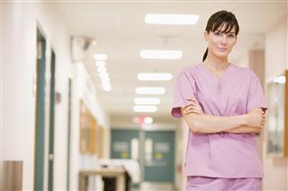 Nurse Standing In A Hospital Corridor