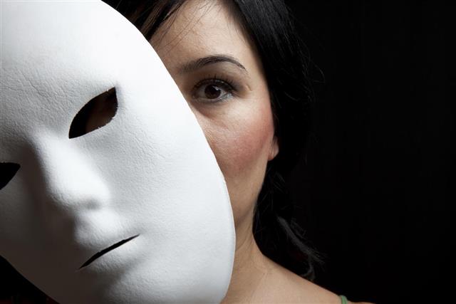 Woman With Black Hair And Dark Eyes Hiding Behind Mask