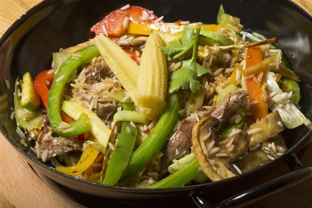 Beef and baby corn stir fry asian fusion dish
