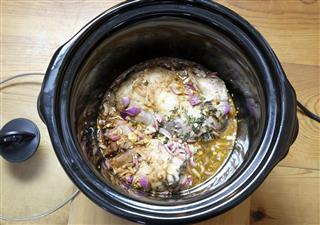 Pulled pork cooking in slow cooker