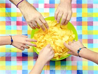 Sharing a bowl of potato chips