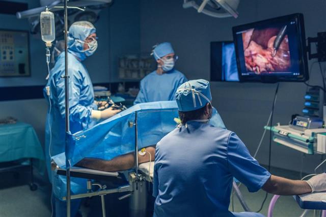 Operating team doing laparoscopic surgery