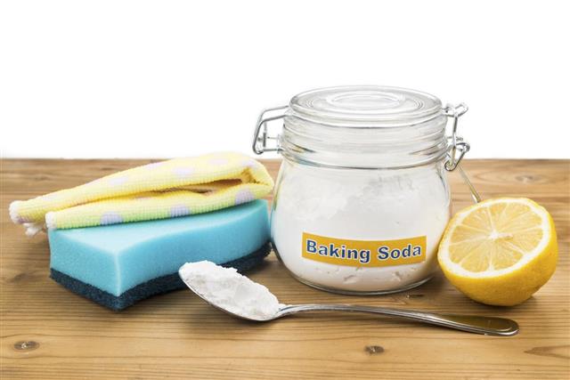 Baking soda lemon sponge and towel for effective house cleaning