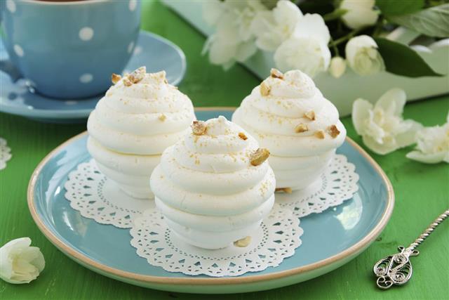 Delicious dessert of meringue filled with hazelnut praline