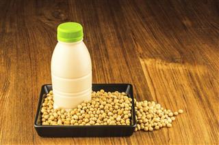 Soybean and a bottle of soybean milk