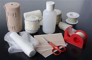 Different rolls of medical bandages and care equipment
