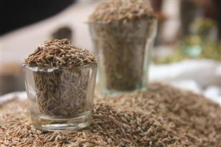 Cumin seeds in glass at local market indian spices