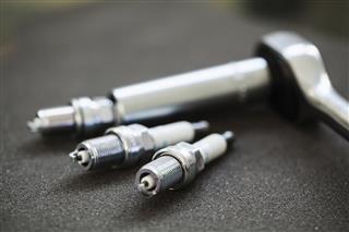 Spark plugs with socket wrench close-up