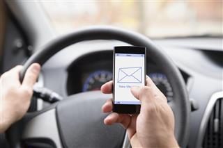 Man Using Cellphone While Driving