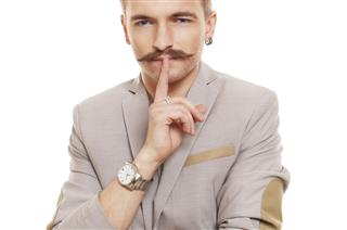 Young man with mustache isolated at white