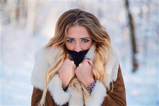 Beautiful young woman outdoor winter portrait