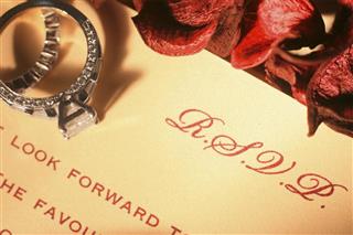 Engagement Ring on Wedding Invitation