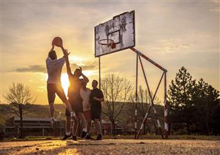 Street basketball at sunset