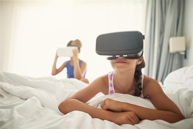 Kids playing with virtual reality headset